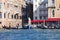 Venetian gondoliers rowing through the Grand Canal, Statue of Liberty, Venice, Italy