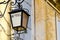 Venetian lantern wrought iron street lamp with hotel sign