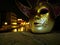 Venetian mask and night canal view