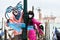 Venetian masked model from the Venice Carnival 2015 with Gondola