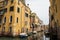 Venetian street, Venice waterway, classical buildings, Venetian architecture, moored boats, shutters, flowers in windows, Italy