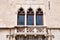 Venetian windows and balcony