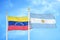 Venezuela and Argentina two flags on flagpoles and blue sky