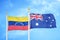 Venezuela and Australia two flags on flagpoles and blue sky