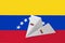 Venezuela flag depicted on paper origami airplane. Handmade arts concept