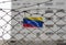 Venezuela flag on the fence of a jail