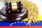 Venezuela flag and Judge hammer with gold grain rice