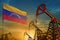 Venezuela oil industry concept. Industrial illustration - Venezuela flag and oil wells against the blue and yellow sunset sky