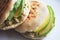 Venezuelan Arepas served on a table served with avocado and chicken