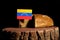 Venezuelan flag on a stump with bread