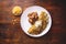 VENEZUELAN FOOD. Corn CACHAPA with cheese and fried pork - cochino frito. Wooden background, top view