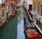 Venice, ancient houses on canal with gondola