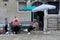 VENICE August 25. Gondoliers on vacation, sitting under umbrella