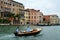 VENICE - AUGUST 25. two men on a motor boat floating on the Gran