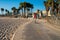 Venice beach vibes. People riding one wheel, bicycles