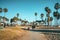 Venice beach vibes. People riding one wheel, bicycles