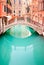 Venice, Bridge on water canal. Long exposure photo