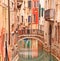 Venice, Bridge on water canal and traditional architecture