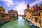 Venice canal in Cannaregio and San Geremia church landmark. Ital