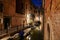 Venice canal at night, buildings and houses facades in Italy