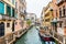 Venice canal and traditional colorful Venetian houses view. Classical Venice skyline. Venice, Italy