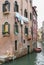 Venice channel, a boy and a boat