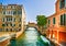 Venice cityscape, boats, water canal, bridge and traditional buildings. Italy, Europe.