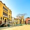 Venice cityscape, bridge, tree and buildings on water grand canal . Italy.