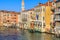 Venice cityscape, narrow water canal, campanile church on background and traditional buildings. Italy, Europe.