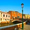 Venice cityscape, street lamp, water canal, bridge and tradition