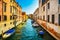 Venice cityscape, water canal, bridge and traditional old buildings. Italy