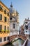 Venice cityscape - water canal, church and residential houses