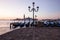 Venice classic sunrise view with gondolas on the waves