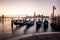 Venice classic view with famous gondolas at sunrise
