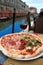 Venice: delicious pizza with a glass of wine