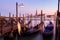 Venice with famous gondolas in lagoon at sunrise