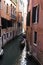 Venice Gondolier in a traditional venetian canal