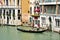 Venice Grand Canal with gondola and old buildings , Italy