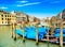 Venice grand canal, gondolas or gondole and Rialto bridge. Italy