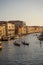 Venice, Italy - 30 June 2018: Gondolier taking tourists on a Gondola ride along the grand canal near Rialto Hotel in Venice, Italy