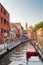 Venice, Italy. Ancient houses, moored boats along the canal