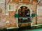 Venice, Italy - April 06, 2018: The waiter looks out the window.