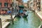 VENICE, ITALY - August 02, 2019: One of the thousands of lovely cozy corners in Venice on a clear sunny day. Locals and tourists