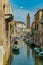 VENICE, ITALY - August 02, 2019: One of the thousands of lovely cozy corners in Venice on a clear sunny day. Locals and tourists