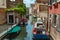 VENICE, ITALY - August 02, 2019: One of the thousands of lovely cozy corners in Venice on a clear sunny day. Locals and tourists