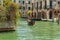 VENICE, ITALY - August 02, 2019: One of the thousands of lovely cozy corners in Venice on a clear sunny day. Locals and tourists