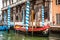 VENICE, ITALY - AUGUST 20, 2016: Traditional gondolas on narrow canal close-up on August 20, 2016 in Venice, Italy.