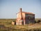 VENICE, ITALY - AUGUST 21, 2017: Old uninhabited house in the late afternoon long the saltmarsh in Lio Piccolo