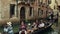 Venice, Italy - August 8, 2017. Asian family taking a ride on a famous Venetian gondola