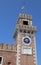 Venice Italy clock tower of an ancient palace called Arsenale